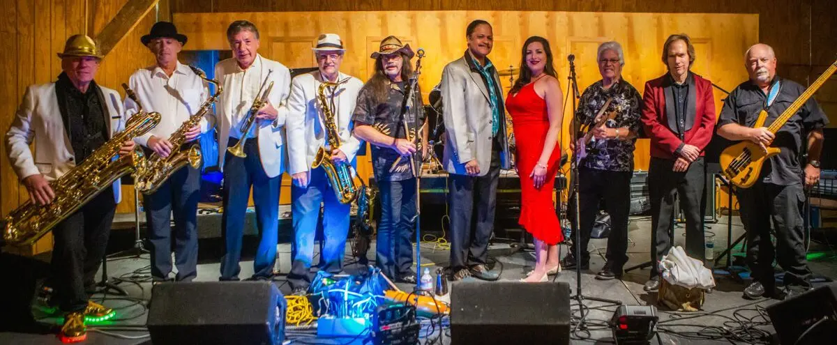 Full band setup with instruments under stage lights