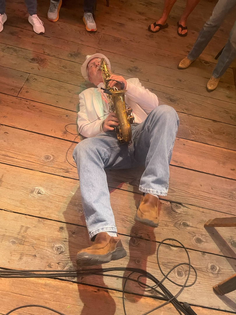 Close-up of saxophone solo with dramatic lighting